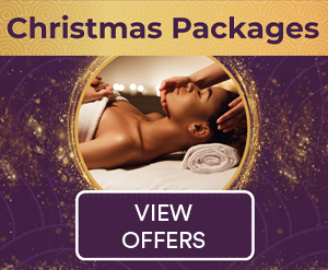 Christmas packages - festive image of lady enjoying a facial treatment in a spa.