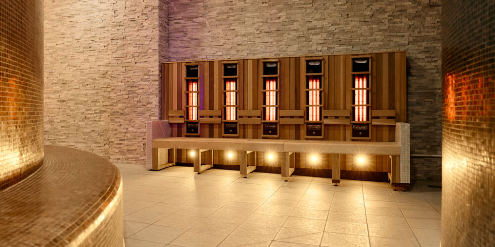 A row of infrared benches with low level lighting in a spa.
