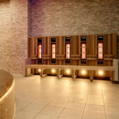 A row of infrared benches with low level lighting in a spa.