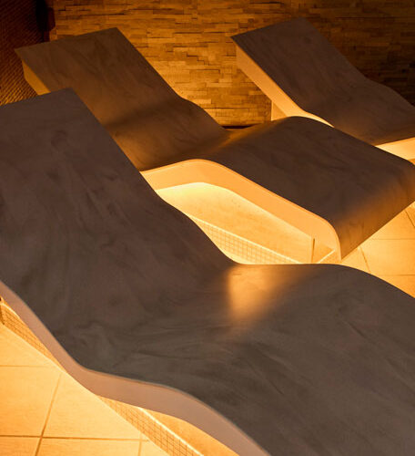 Curved heated benches in a spa.