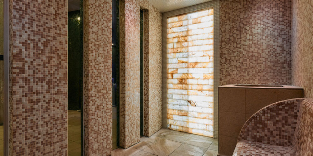 Himalayan salt experience area with tiles and atmospheric lighting.
