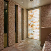 Himalayan salt experience area with tiles and atmospheric lighting.