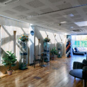 Relaxation area with comfy chairs leading out to the outdoor sun terrace.