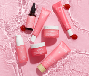 Caudalie Vinosource products in vibrant pink and red packaging