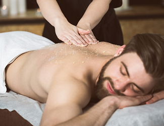Man receiving back massage treatment