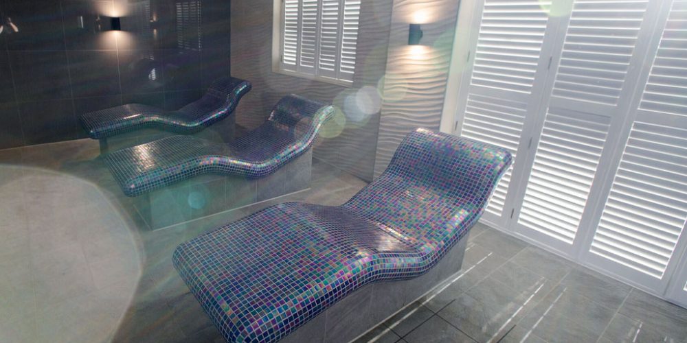 Moulton Spa's blue mosaic heated benches.