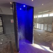 Moulton spa shower with blue mood lighting