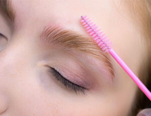 Lady receiving a brow lamination treatment