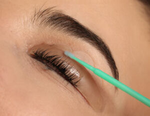 Lady receiving lash lift treatment. 