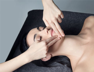 Lady receiving a relaxing facial treatment